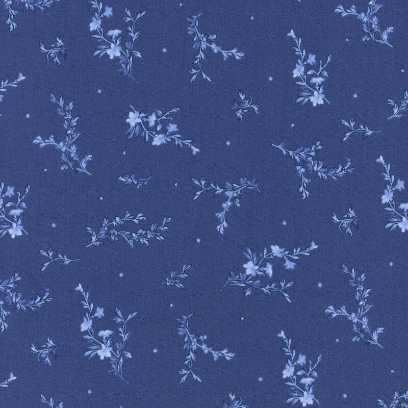 Navy blue fabric with tossed leafy sprigs and small dots.