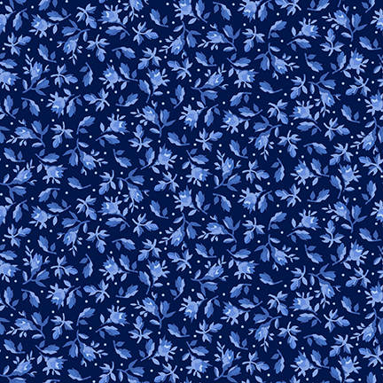 Navy blue fabric decorated with small leaves and florals amongst scattered pinprick dots.