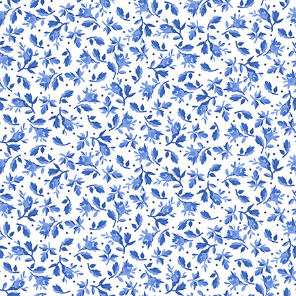 White fabric decorated with small leaves and florals amongst scattered pinprick dots.