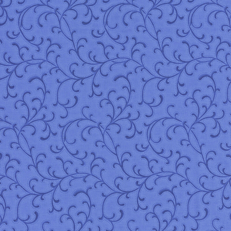Bright ultramarine fabric with lightly dotted swirling ornamental accents.