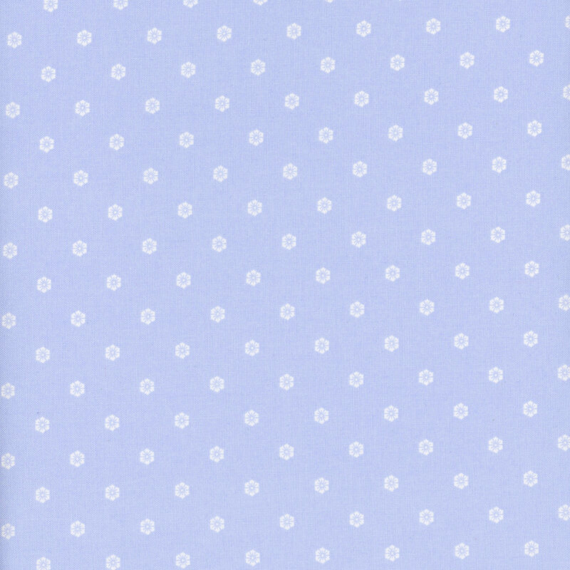 Periwinkle blue fabric with a neat design of hexagonal florals.
