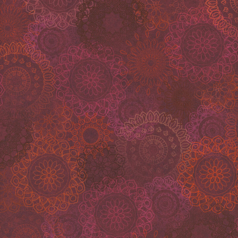 Red and maroon fabric featuring intricate, overlapping mandala patterns in various sizes.
