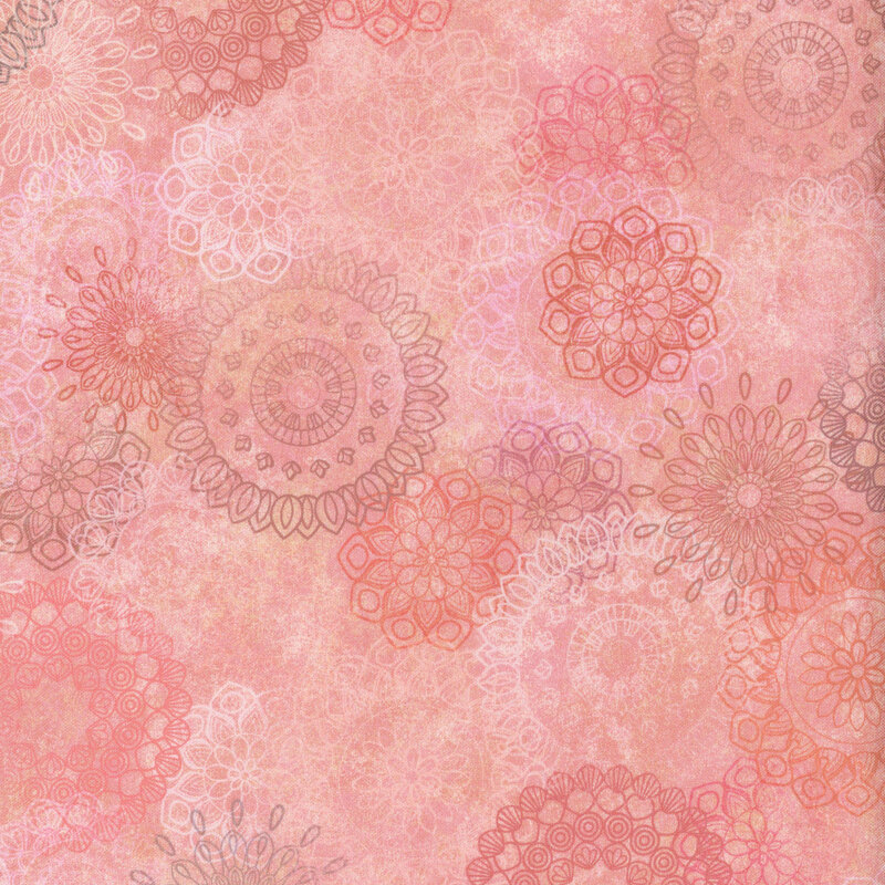 Abstract pattern featuring various floral mandala designs in shades of pink and coral.