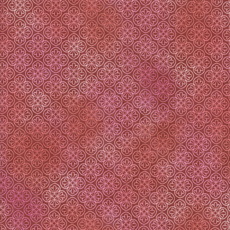 Mottled red, pink, and orange fabric featuring a repeating floral pattern.