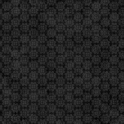 Black fabric featuring a subtle pattern of small floral shapes.