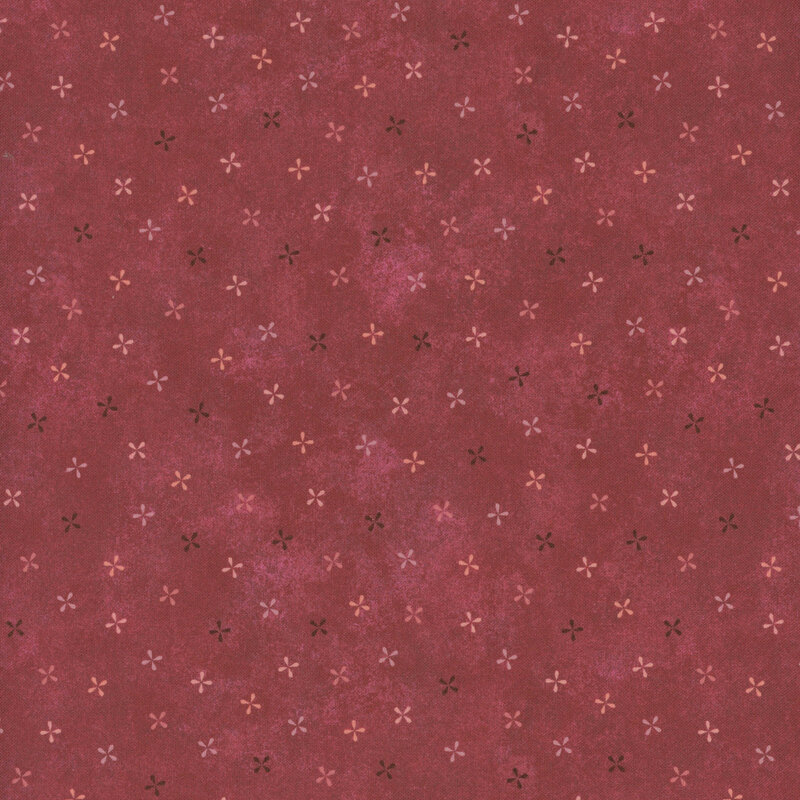 Red fabric with small, scattered pink and orange floral patterns.