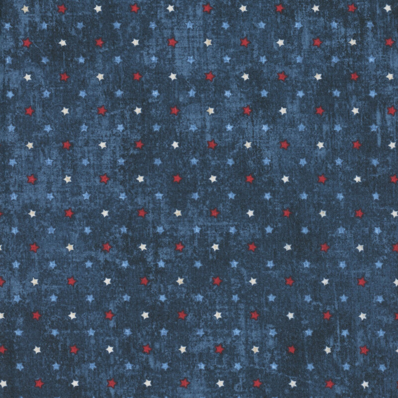 Dark blue fabric with a repeated pattern of small white, blue, and red stars.