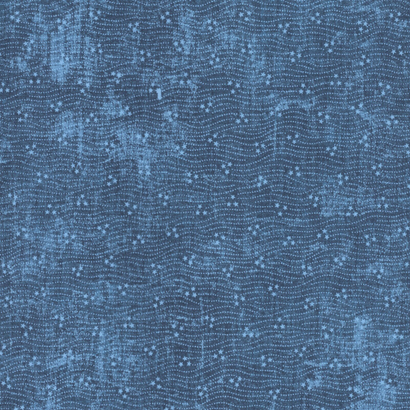 Blue fabric with subtle tonal dots scattered around.