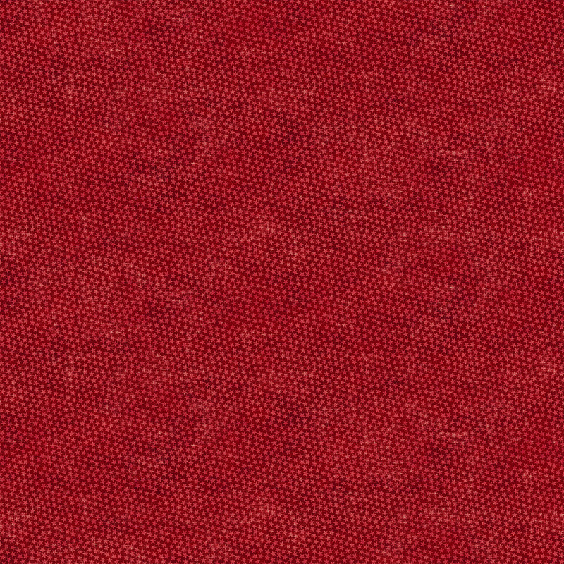 Red fabric pattern with a tonal small dense star pattern. 