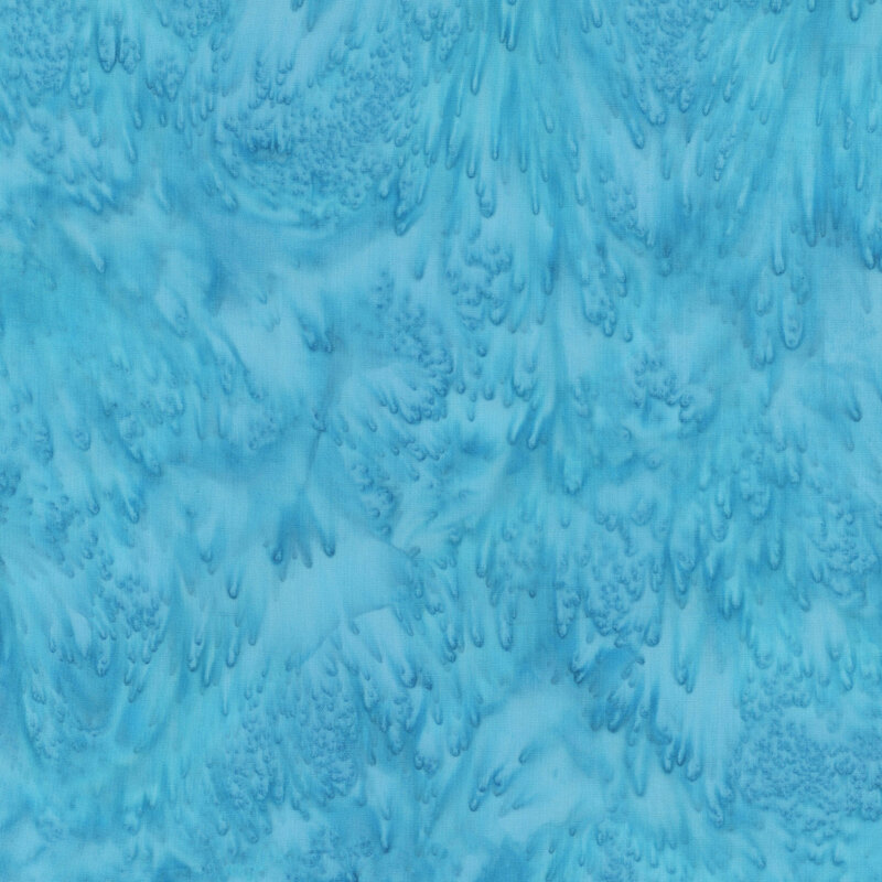 Aqua batik fabric featuring a mottled watercolor design.