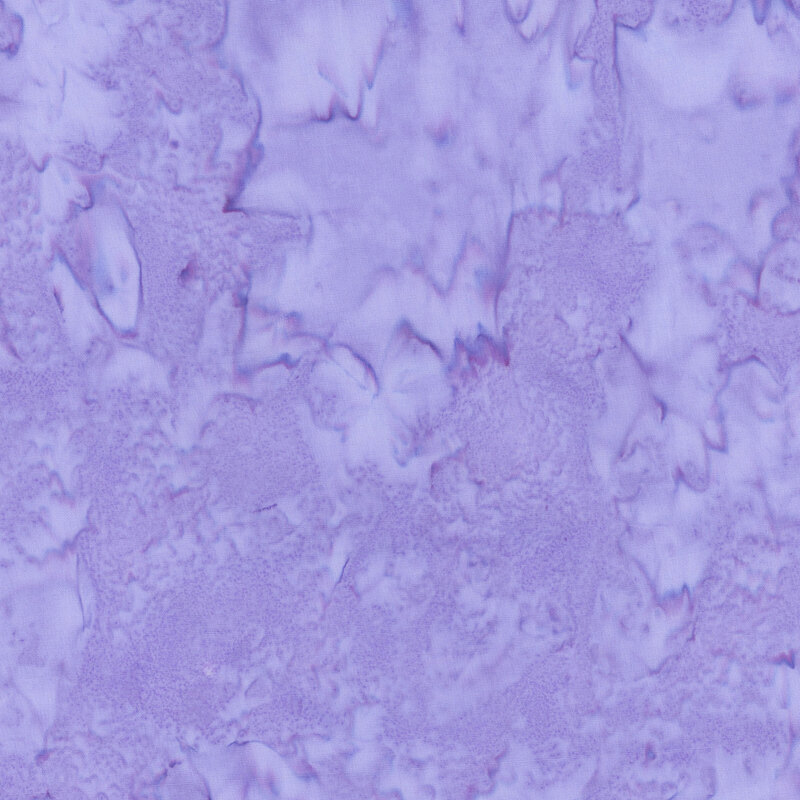 Periwinkle batik fabric featuring a mottled watercolor design.