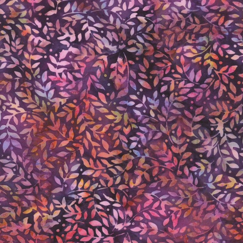 Mottled purple fabric with a sprawling design of multicolored leaves.