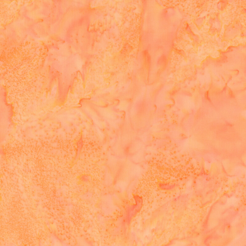 Light orange batik fabric featuring a mottled watercolor design.