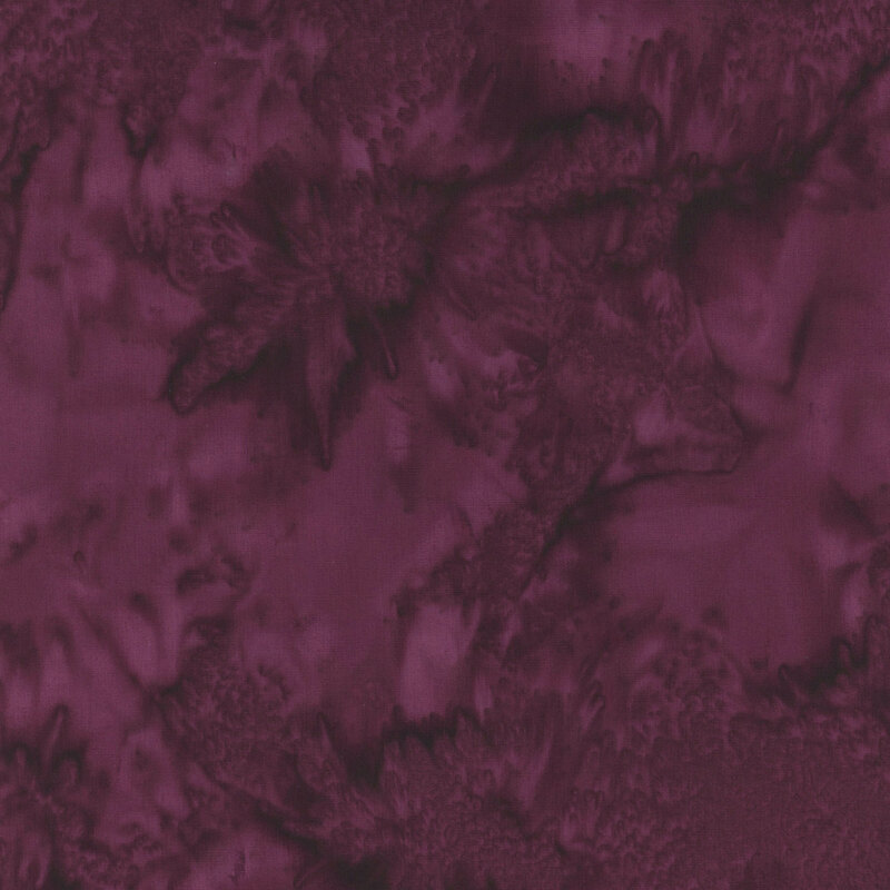Abstract fabric texture in deep burgundy with swirls and soft details.