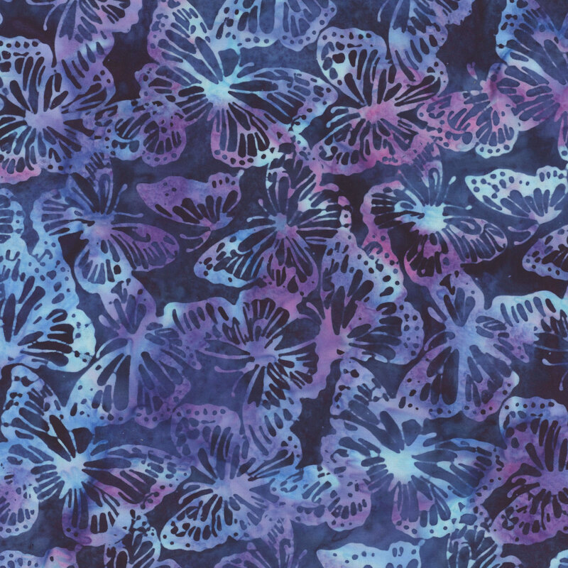 A vibrant pattern of blue, teal, and purple butterflies on a dark blue fabric.