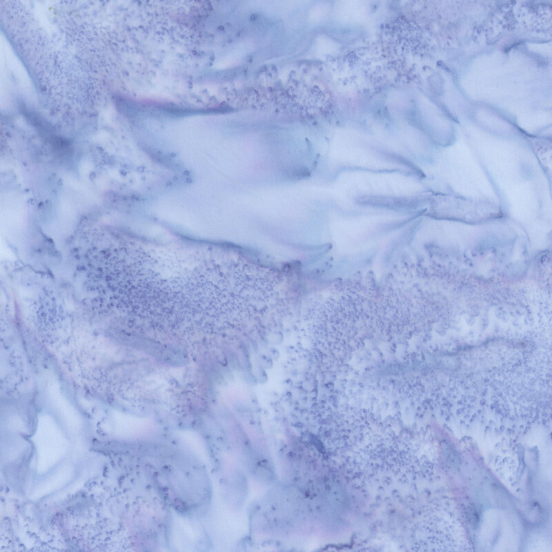 Powder blue batik fabric featuring a mottled watercolor design.