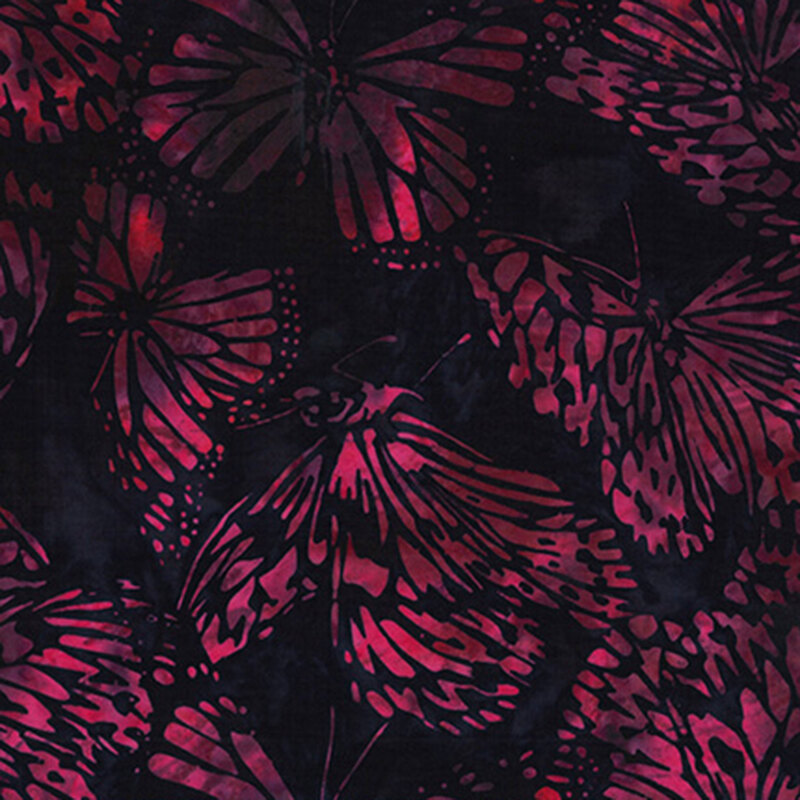 Mottled fuchsia butterflies tossed on a black fabric.