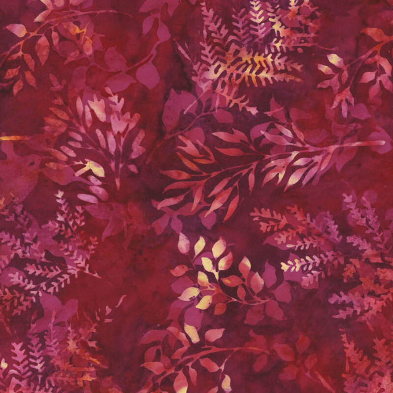 Mottled dusty rose and salmon pink leaf silhouettes tossed on a mottled red fabric.