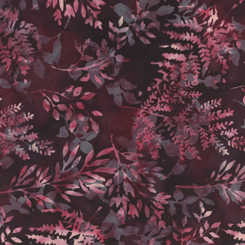 Mottled crimson and pink leaf silhouettes tossed on a mottled black fabric.