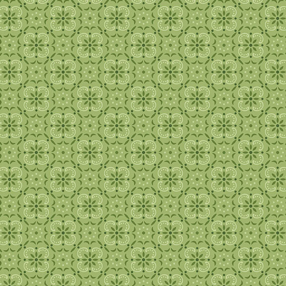 Leaf green fabric with a geometric and tonal floral emblem pattern. 