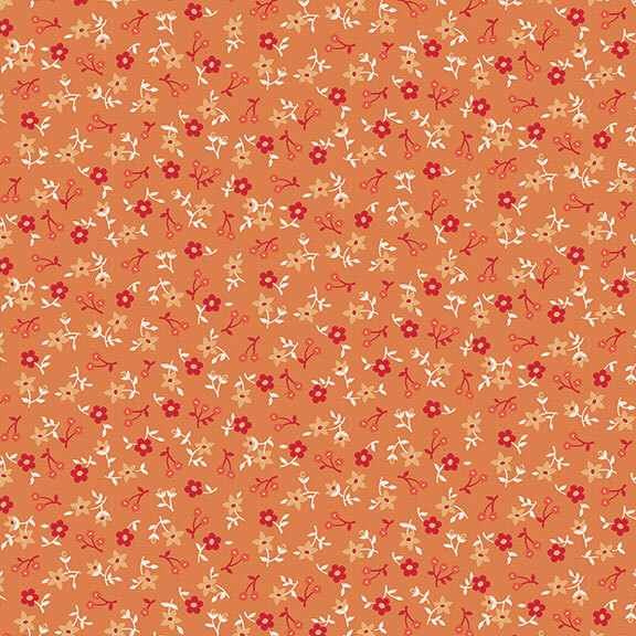 Carrot orange fabric with a calico tonal, red, and white floral design.