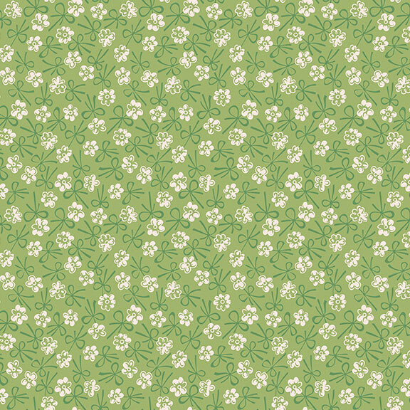 Leaf green fabric with a white floral and tonal bow design.