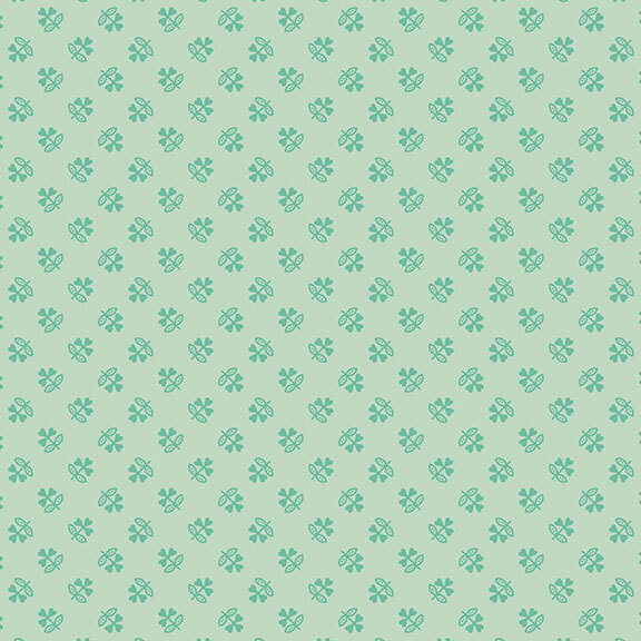 Mint green fabric with a tonal ditsy pattern of stylized clovers.