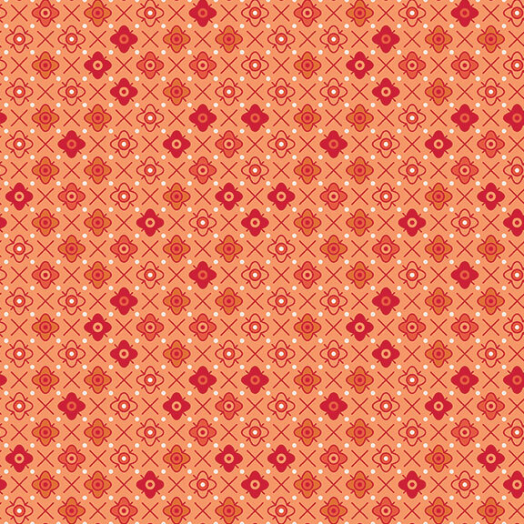 Orange fabric with a orange tonal floral emblem pattern.