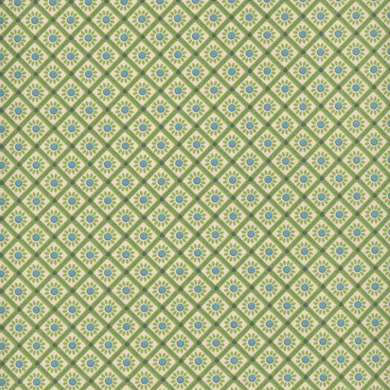 White fabric with a green lattice pattern framing little green and blue flowers.