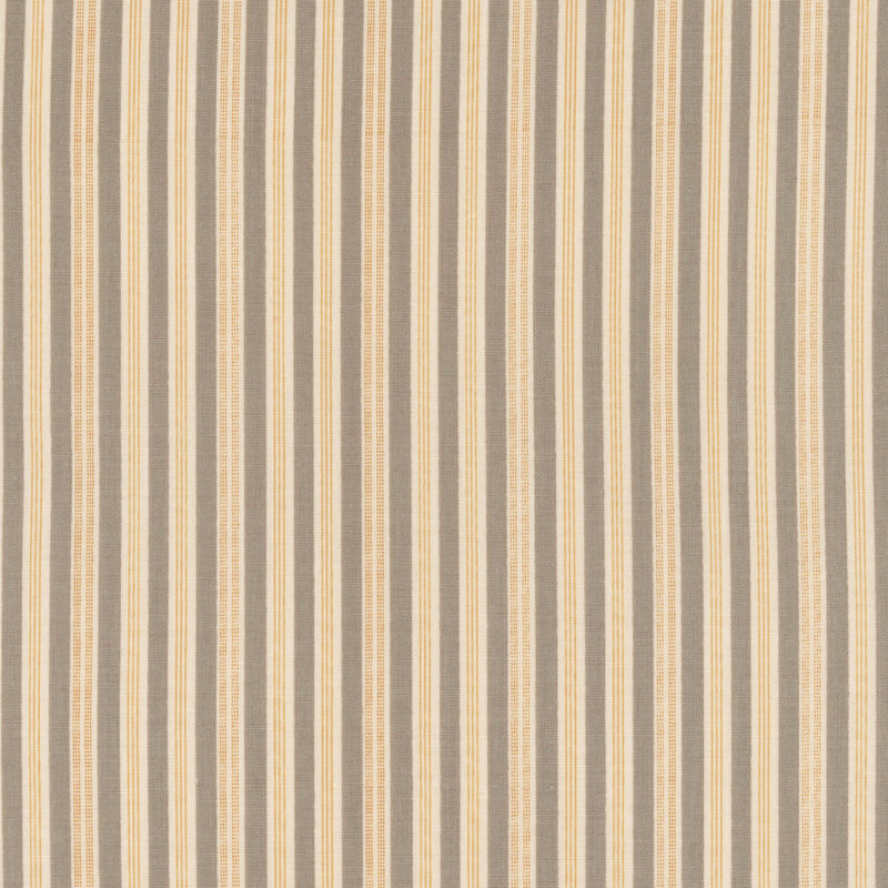Fabric with gray, orange, and white ticking stripes.