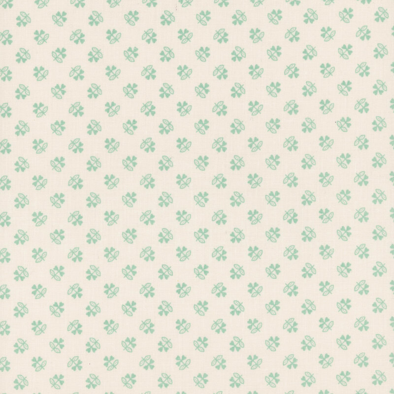 Cream fabric with a stylized clover pattern in mint.