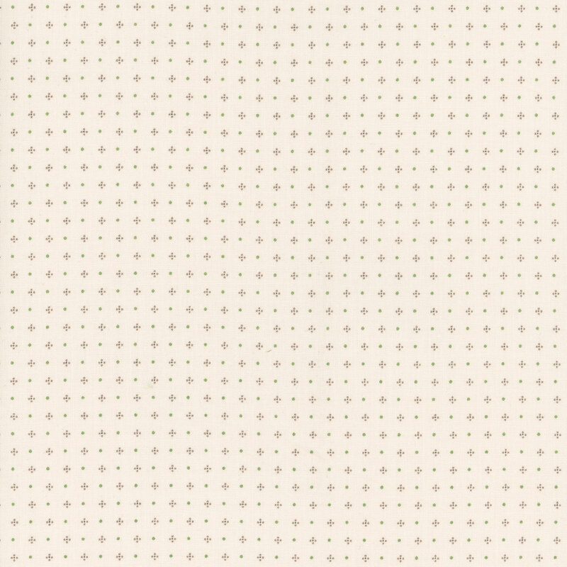 Cream fabric with rows of dots and dot clusters in tonal beige and green.