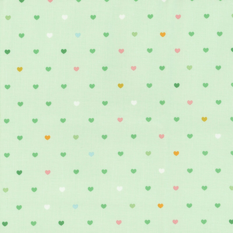 Mint green fabric with rows of multicolor hearts.