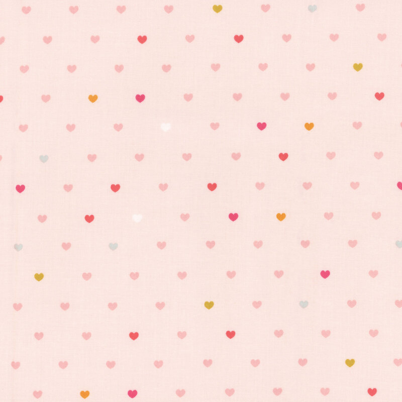 Blush pink fabric with rows of multicolor hearts.
