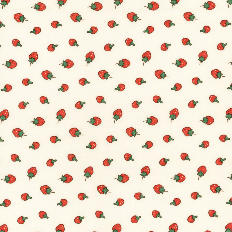Cream fabric with a ditsy red strawberry pattern.