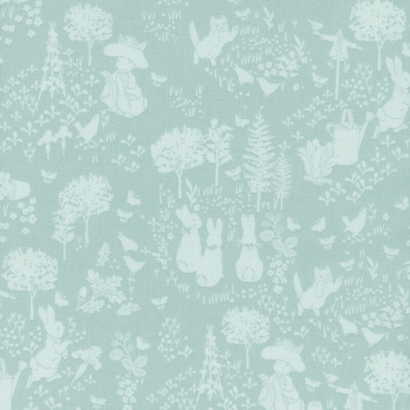 Tonal blue fabric featuring rabbits and trees in an outdoor garden.