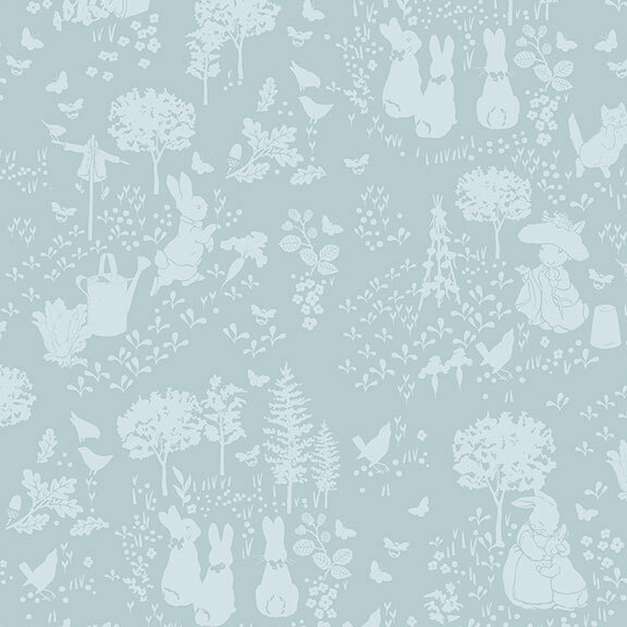 Tonal blue fabric featuring rabbits and trees in an outdoor garden.