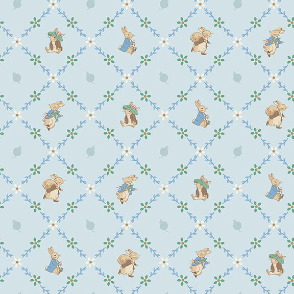The storybook rabbits, Peter and Benjamin, pose inside floral lattice on light blue fabric.