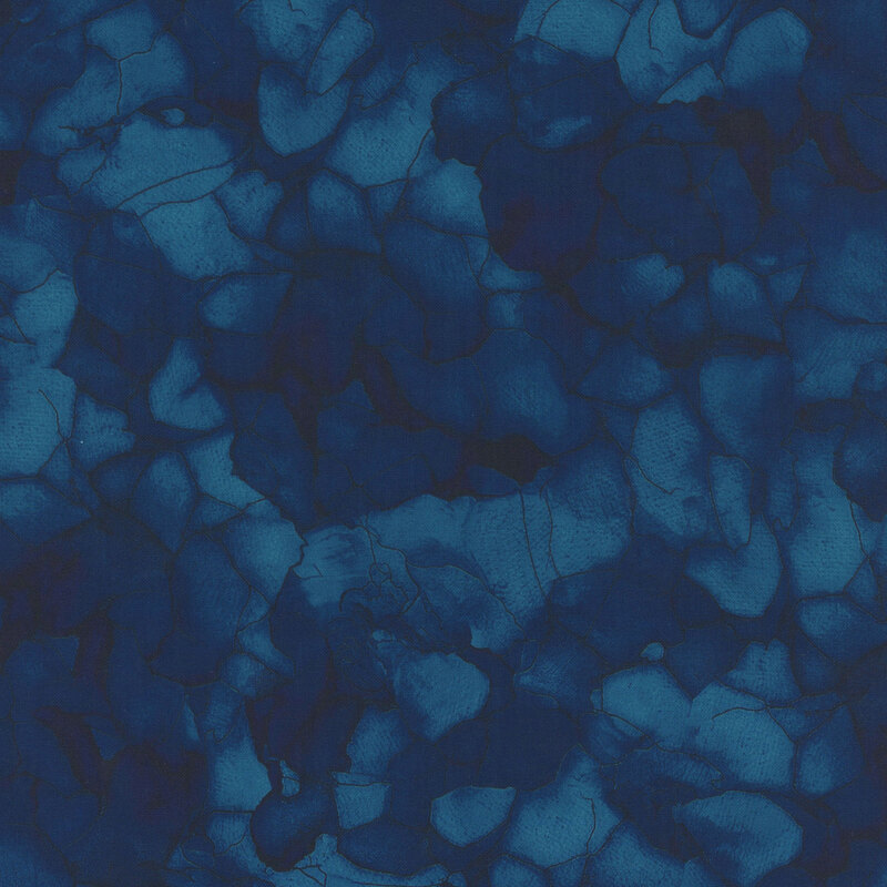 A tonal dark blue fabric with a mottled design. 