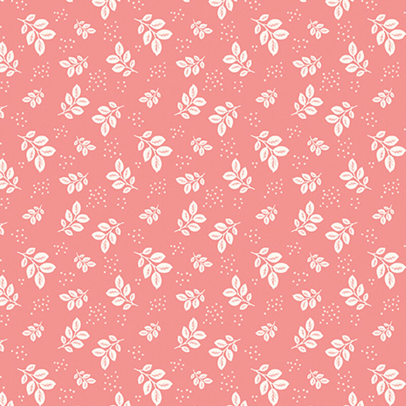 Coral pink fabric with white leaves and clusters of pin dots.