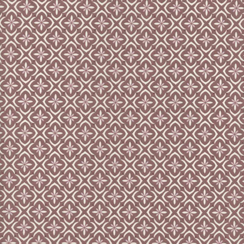 Purple fabric with a white and tonal tiled floral medallion pattern.