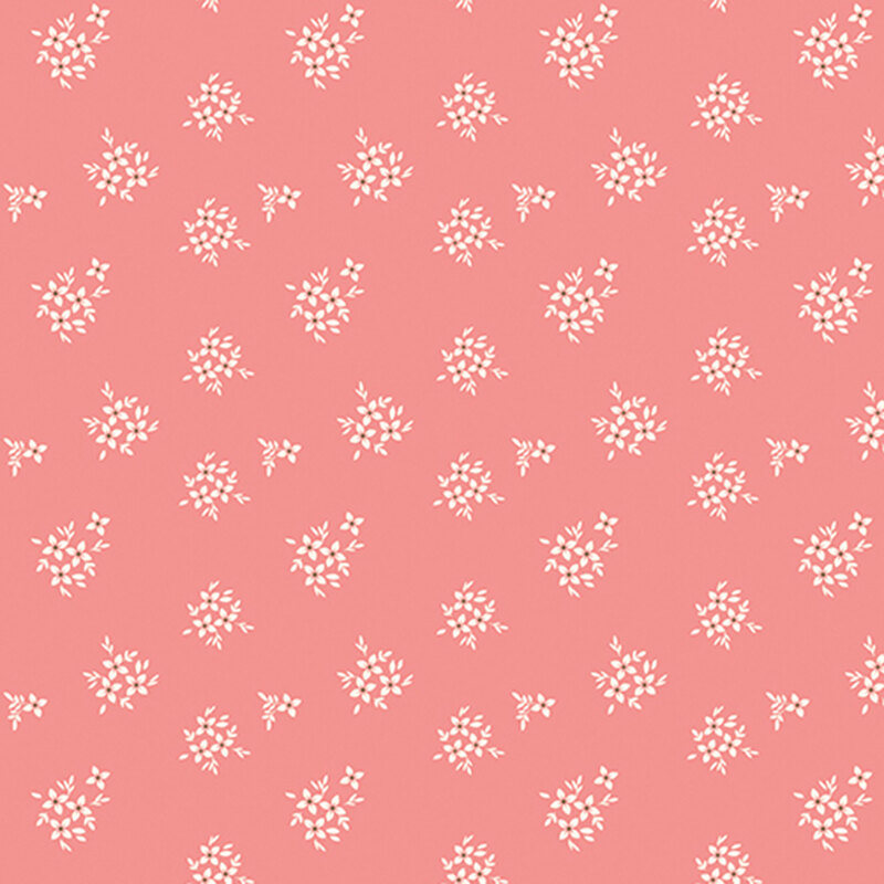 Coral pink fabric with white floral clusters.