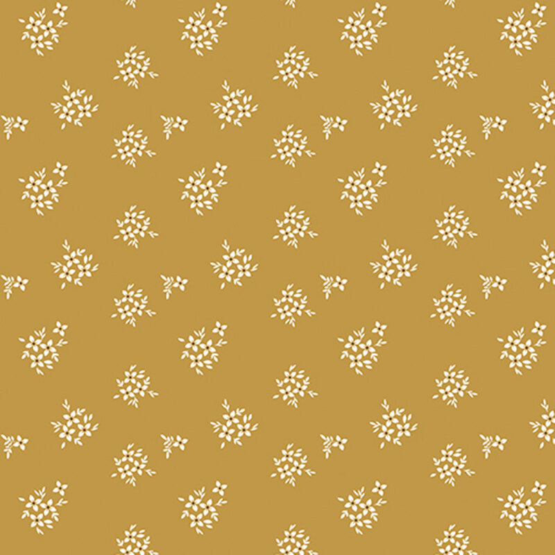 Mustard gold fabric with white floral clusters.