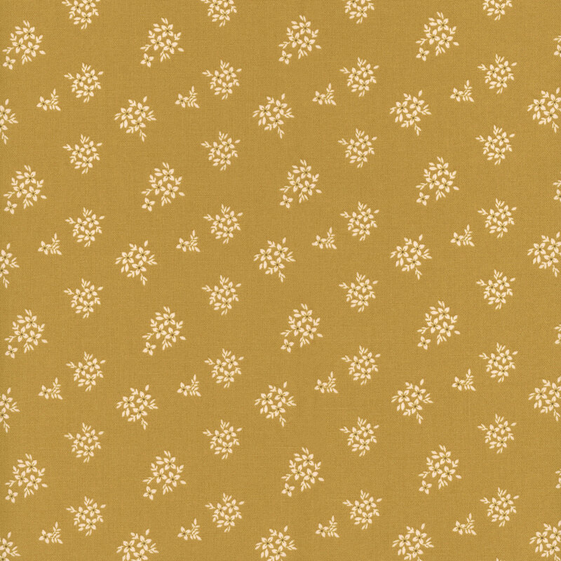 Mustard gold fabric with white floral clusters.