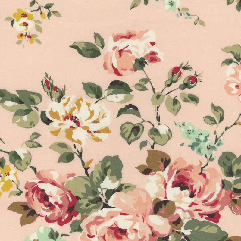 Soft pink fabric featuring shabby florals in pink, blue, and yellow.