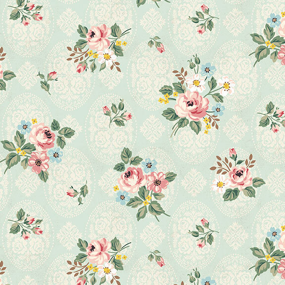Light aqua fabric decorated with an intricate floral pattern and tossed with floral designs with roses and greenery.