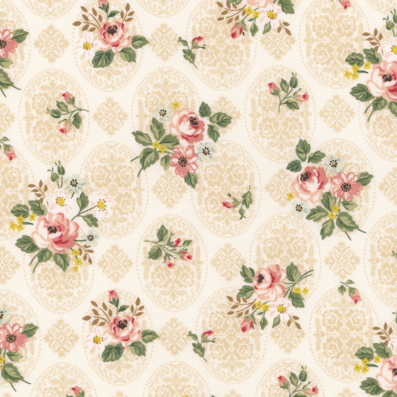 Light cream fabric decorated with an intricate floral pattern and tossed with bunches of roses and greenery.