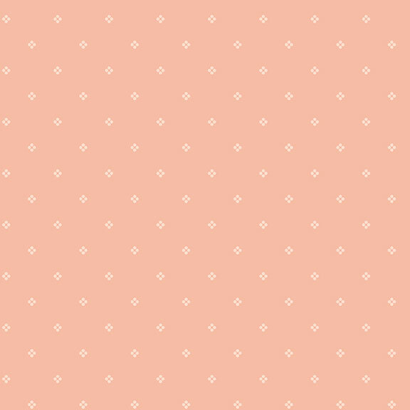 Light peach fabric with a subtle pattern of small white florals