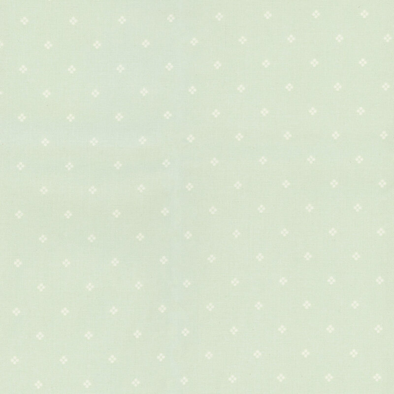 Light turquoise fabric with a subtle pattern of small white dots.