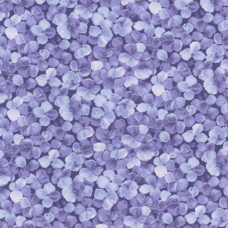 Periwinkle blue fabric with a packed hydrangea flower motif.